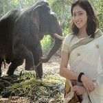 Pic Talk: Mass Lady Poses With Elephant